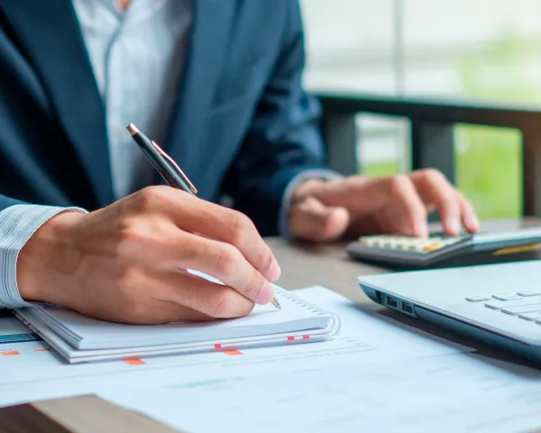 Person working and taking notes